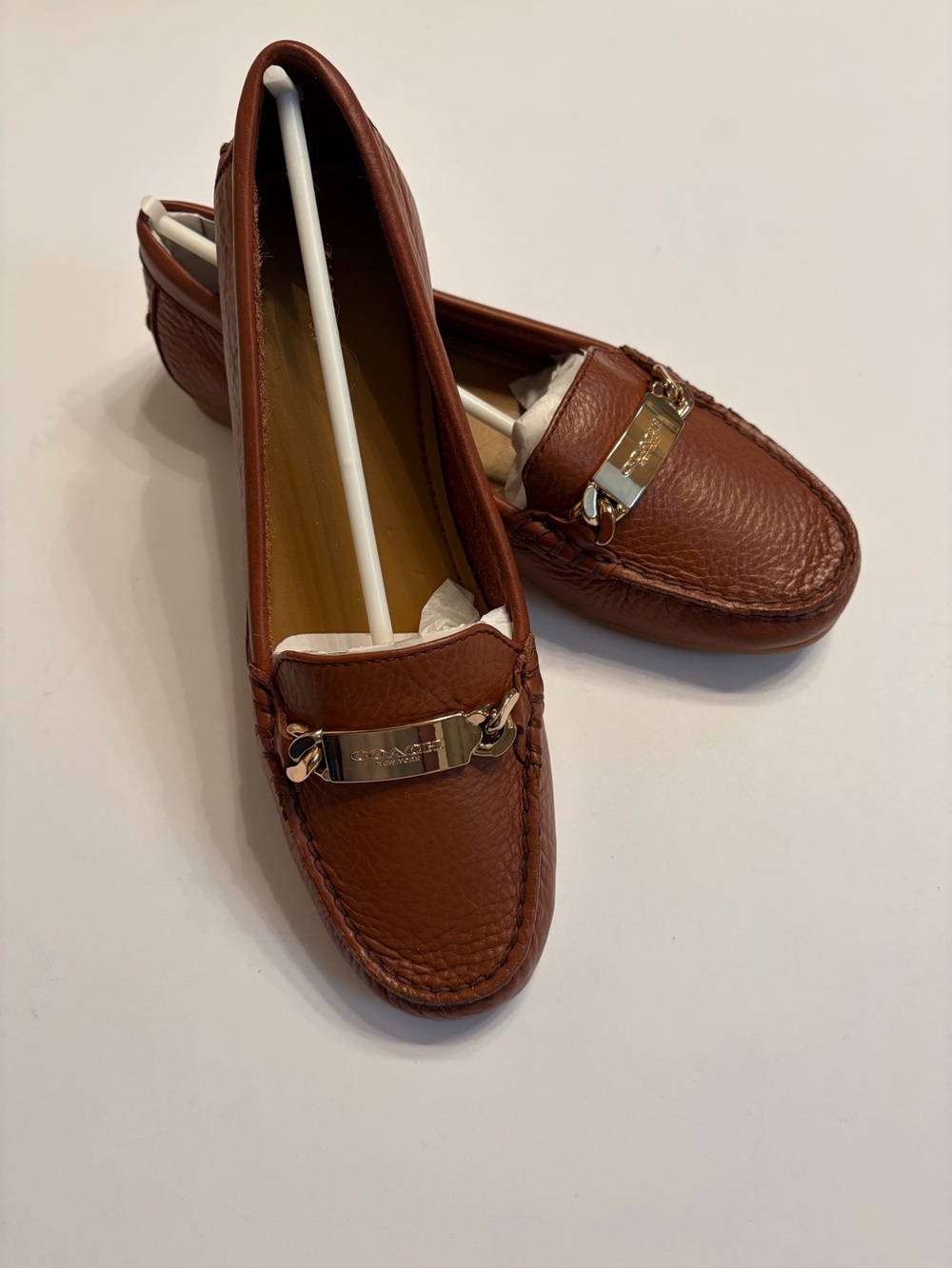 Coach Women's Olive pebble grain leather loafers in Saddle brown